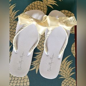 White and cream Bride flip flop. Size 11. Never wore.